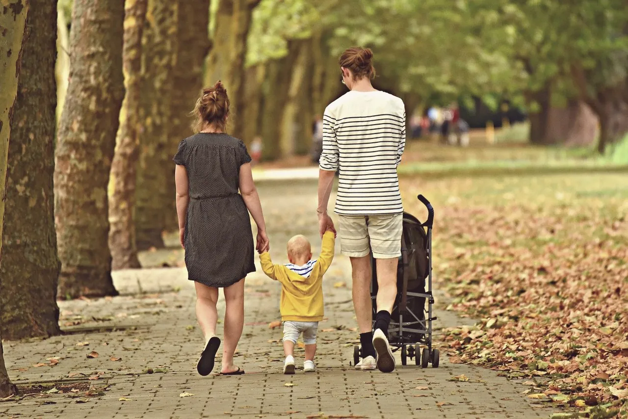 A family walking together in an autumn park